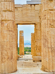 Propylaea, the ancient gateway to the Athenian Acropolis, with the city of Athens in background....