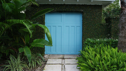 Blue gate door to a garden