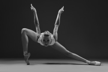 Ballerina like a predatory bird. Black and white photo.