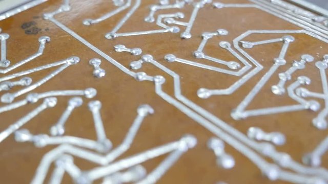 Retro pcb circuit tracks. Old style microcircuit. Closeup
