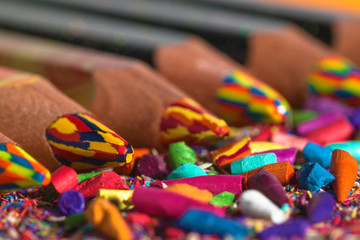 Obraz premium Colourful pencils row with pencil graphite and shavings. Back to school background. Macro photography.