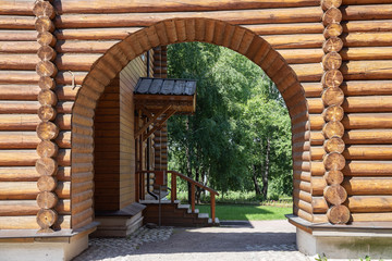 Arches in the courtyard of an old traditional Russian wooden house from logs