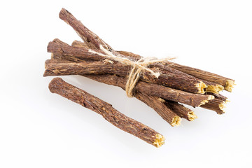 Licorice roots close up on the white - glycyrrhiza glabra