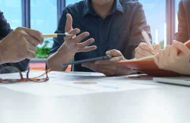 Executives and employees are analyzing data with Secretary notes the meeting.