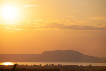 Obraz premium Sunset at lake Balaton with the Badacsony mountain in Hungary