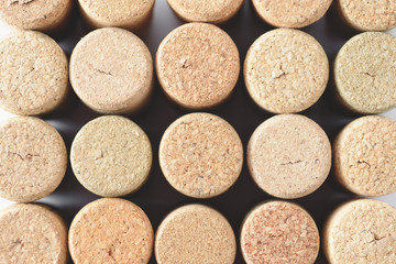 Pile of assorted used wine corks background. Close up top view.