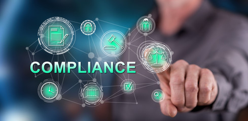 Man touching a compliance concept