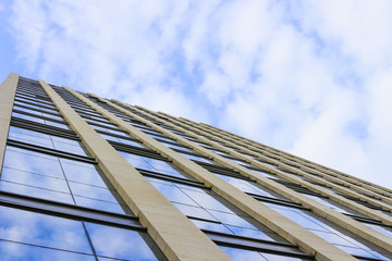 Fototapeta na wymiar Looking up at skyscrapers under a clear sky