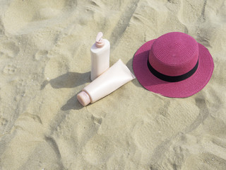 Sunscreen, hat On the beach in summer.