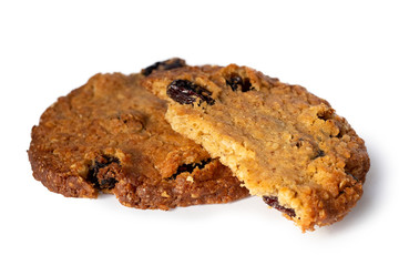 One and half oat and raisin round biscuits isolated on white.