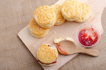 Homemade Cheese Scones with jam strawberry  on the wood Plate