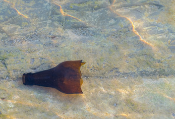 Broken bottle on the beach