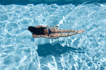 woman swims underwater