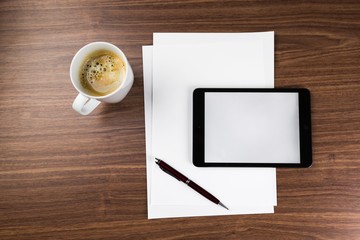 Business Desk with Blank Digital Tablet, Coffee and White Papers