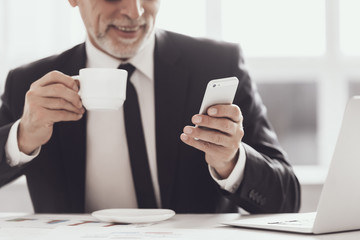 Smiling Adult Businessman on Coffee Break at Work