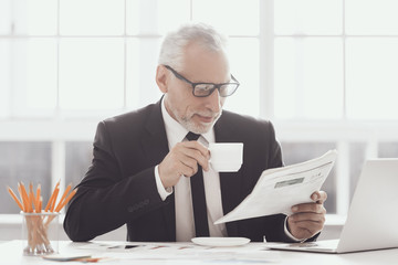 Smiling Adult Businessman on Coffee Break at Work