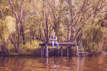 man with fishing rod catching fish.