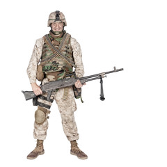 Studio shoot of army, marine machine gunner in camouflage combat uniform and body armor, standing with machine gun, isolated on white