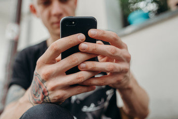 Close up of man using mobile smart phone.