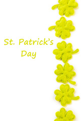 St Patricks Day side border of cloth shamrocks isolated on white