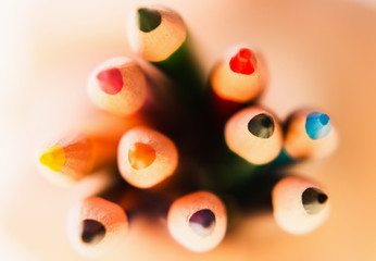 Color pencils in hand isolated on white background.