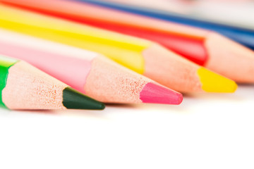 Color pencils isolated on white background, macro view.