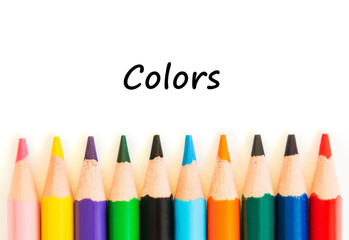 Fototapeta premium Color pencils isolated on white background. Text colors.