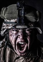 Close up portrait of aggressive screaming army soldier, attacking with mad yelling commando,...