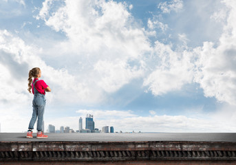 Fototapeta premium Concept of careless happy childhood with girl looking far away