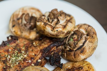 Grilled Steak and Mushrooms on the Plate - Close Up