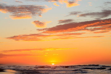 Obraz na płótnie Canvas Dramatic Tropical Sunrise over Pacific Ocean and Sandy Beach