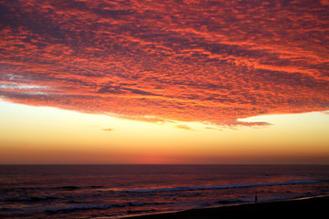 Dramatic Volcanic Crimson Sunset over Pacific Ocean