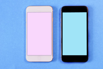 white and black smartphone on a color background