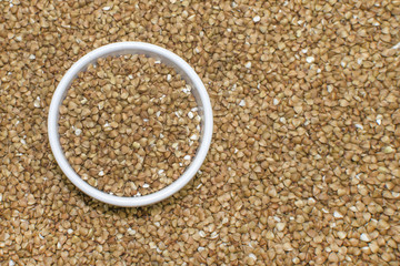 Buckwheat in a plate close up. Background image