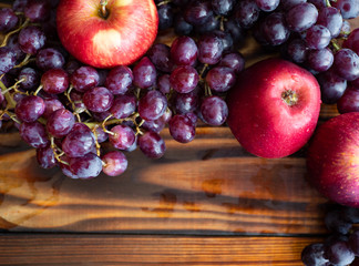beautiful fruit on dark wooden background, copy space