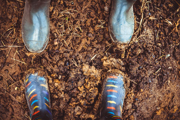 rubber boots in mud
