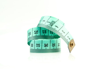 isolated green measuring tape on a white background