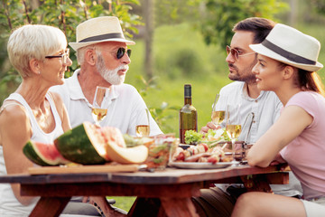 Family having barbecue party in backyard
