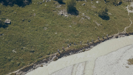 Top view hiker people traveling on background mountain river. Hiking mountain