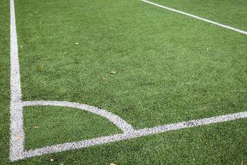 Closeup of Corner kick line of football and soccer field, background texture