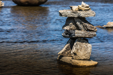 Inukshuk by the river edge.