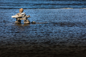 Inukshuk by the river edge.