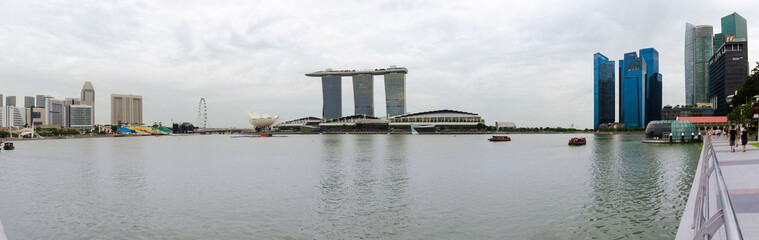 Naklejka premium SINGAPORE - 17 Jul 2014: the Marina Bay and Central Business district appear as a skyline in this panorama view of central Singapore.