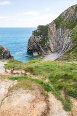 Limestone Foldings on Stair Hole Chalk Cliffs and Atlantic Ocean.