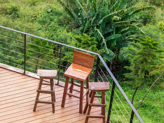 High angle view of wooden chairs on the back porch.