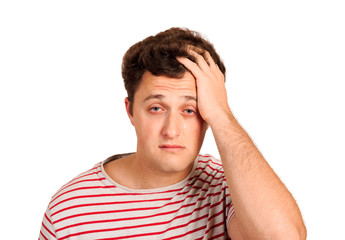 Fototapeta premium portrait of a crying man holding his head in despair. emotional man isolated on white background