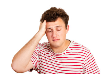 portrait of a crying man holding his head in despair. emotional man isolated on white background