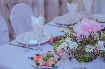 Wedding decor in pink and mint tones, fresh flowers peonies and roses