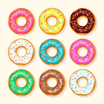 Pink donut, chocolate donut, lemon and blue mint donuts with different topping on white background