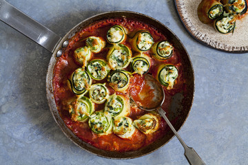 Courgette stuffed with ricotta, spinach and peas in tomato sauce